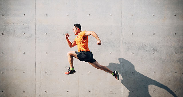 A young man is sprinting